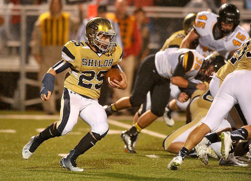 Shiloh Christian running back Kyle Freeman looks for a hole to run through Friday night against Prairie Grove. Shiloh battled back from a 14-point deficit to win 27-20.