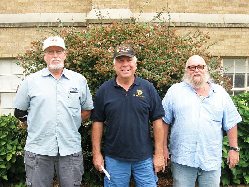 The Sentinel-Record/Jeff Smith HELPING THE CAUSE: James L. Whitby Chapter 5 Disabled American Veteran members, from left, Michael Sharp, Steve Smith and Benny Arego, work diligently to help other veterans receive earned benefits as well as helping with transportation needs.