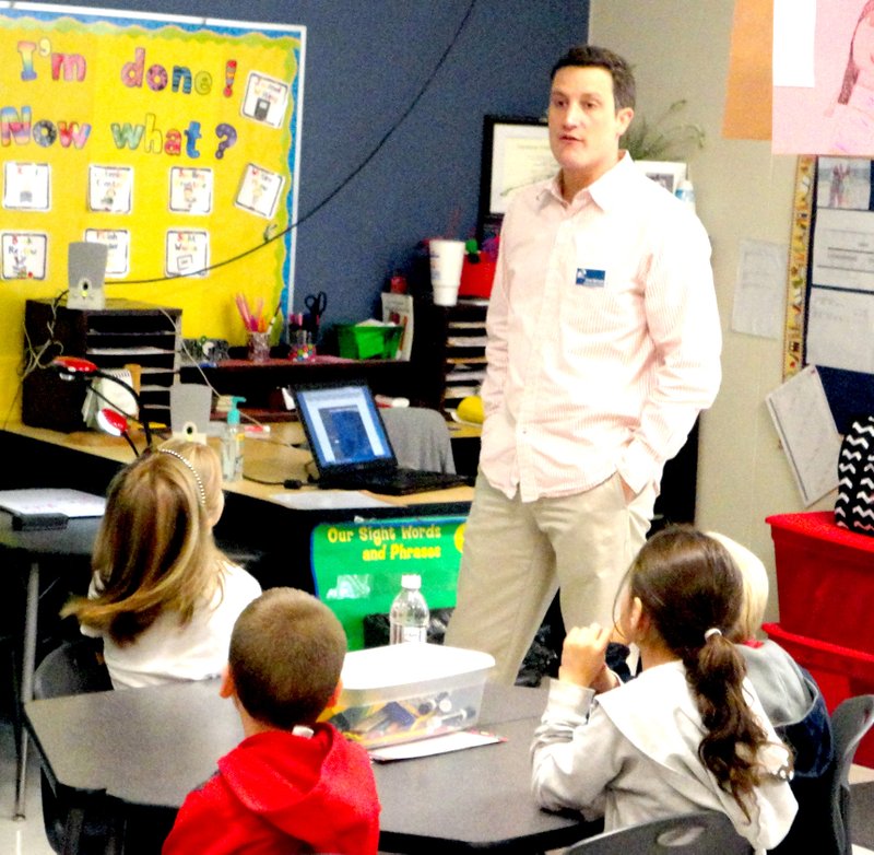 Drew Michaels, chief meteorologist for KHOG TV, 40/29, talks to the second grade classes at Decatur&#8217;s Northside Elementary School on Oct. 6 about the water cycle and the effect it has on everyday life. Photo by Mike Eckels