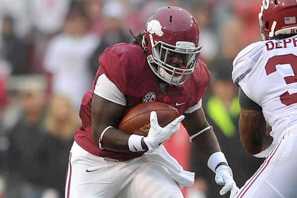 Arkansas running back Alex Collins looks for a running lane during the Razorbacks' game against Alabama on Saturday, Oct. 11, 2014 at Razorback Stadium in Fayetteville. 