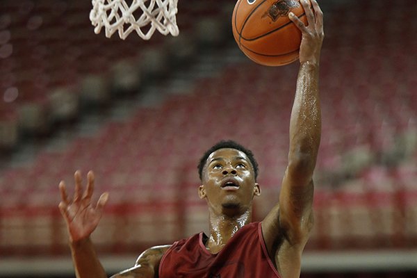Arkansas guard Anthlon Bell goes for a layup during a practice Tuesday, Oct. 7, 2014 at Bud Walton Arena in Fayetteville. 