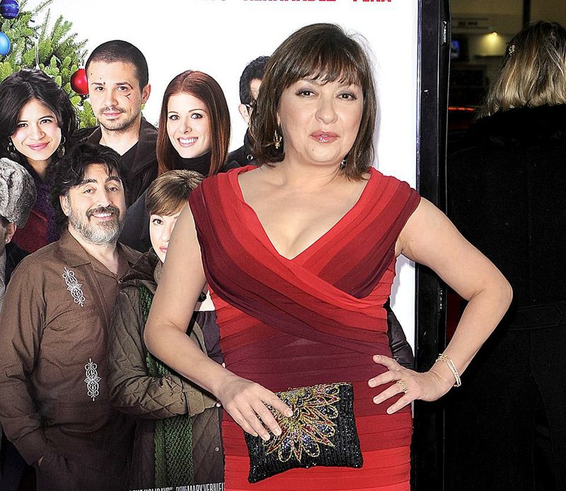 FILE - In this Dec. 3, 2008 file photo, Elizabeth Pena poses as she arrives for the Los Angeles premiere of "Nothing Like the Holidays," in Los Angeles. The "La Bamba" and "Lone Star" actress Pena, 55, has died. Pena's manager, Gina Rugolo, said the actress died Tuesday, Oct. 14, 2014, in Los Angeles of natural causes after a brief illness. (AP Photo/Mark J. Terrill, file)