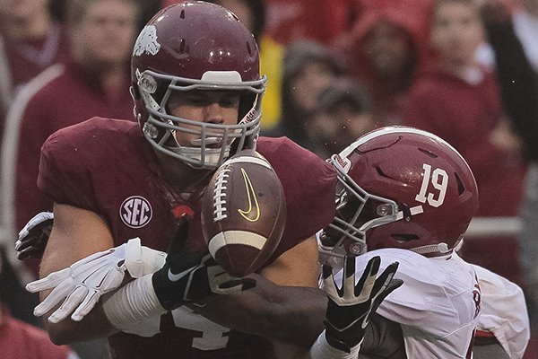 Arkansas tight end Hunter Henry is interfered with by Alabama defender Reggie Ragland during a game Saturday, Oct. 11, 2014 at Razorback Stadium in Fayetteville. 