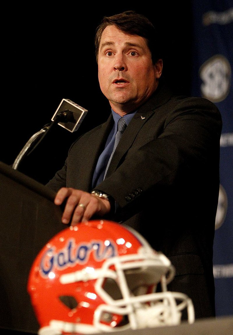 Florida Coach Will Muschamp speaks to media at SEC media days on Monday, July 14, 2014, in Hoover, Ala. (AP Photo/Butch Dill)