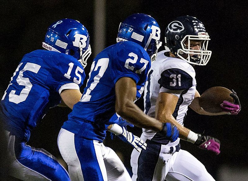 Arkansas Democrat-Gazette/MELISSA SUE GERRITS - 10/17/2014 - Bryant's Ben Bruick, left, and Steven Murdock, center, follow close to Greenwood's Jordan Green during their game at Bryant October 17, 2014. 