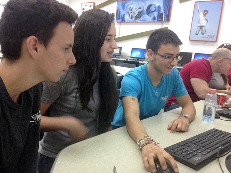 From left, Gal Londe, Alona Haimov and Edo Nahman, all high school students, are shown on June 17 in one of Israel's new cyber classrooms in Holon, Israel. They not only learn how the Internet operates but how "bad guys" hack into systems to steal data, insert malware or eavesdrop on communications. Illustrates ISRAEL-CYBER (category i), by William Booth (c) 2014, The Washington Post. Moved Wednesday, Oct. 8, 2014. (MUST CREDIT: Washington Post photo by William Booth)