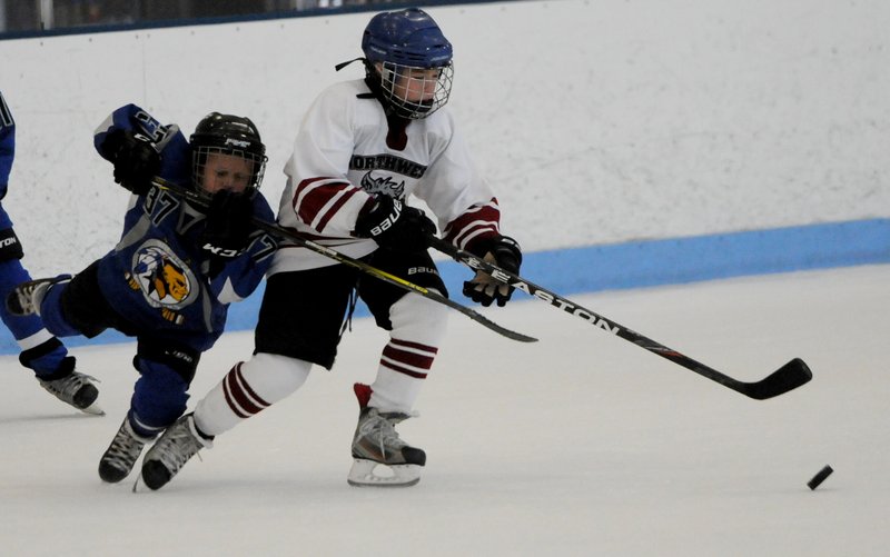 Peirce Saunders chases the puck Sunday Oct. 12, 2014 against Wichita.