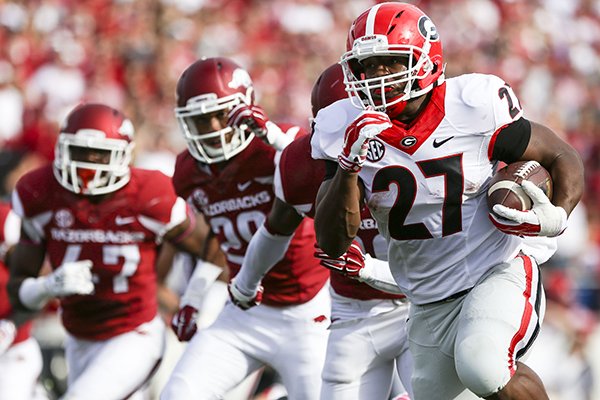 Georgia running back Nick Chubb runs for a touchdown during the second quarter of a game against Arkansas on Saturday, Oct. 18, 2014 at War Memorial Stadium in Little Rock. 