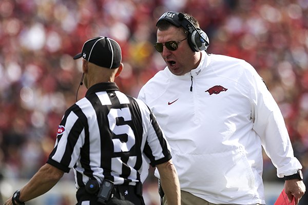 Arkansas coach Bret Bielema argues a call during the first quarter of a game against Georgia on Saturday, Oct. 18, 2014 at War Memorial Stadium in Little Rock. 