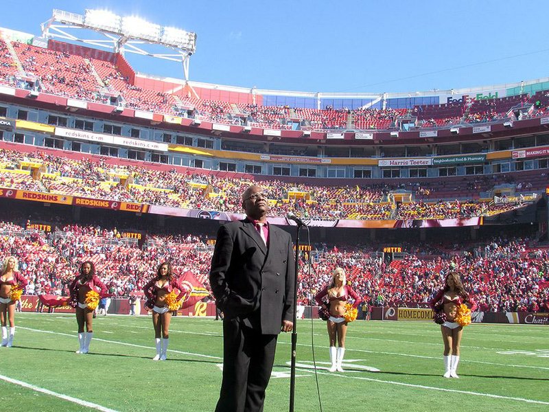 Arkansas Democrat-Gazette/SARAH D. WIRE
D.C. Washington, a McGehee native living in Washington, performs the national anthem at the Redskins football game.