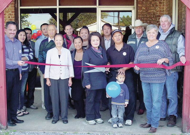 Photo by Randy Moll Gentry Chamber of Commerce sponsored a ribbon cutting at Sunrise Cafe on Thursday. Present for the event were Gentry mayor Kevin Johnston, Andrea Tun, Carlos Sandoval, David Thao, Nau Her Thao, Youa Thau, Amber Jeka, Pachee Lor, Marcia Thao, Chue Fong Yang (pastor), Dao Thao (owner), Chai Lee (owner), Samuel Lee, Jack Elder, chamber director Bev Saunders and Jim Kooistra.