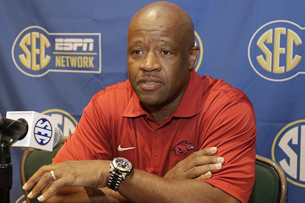 Arkansas head coach Mike Anderson answers a question during a news conference at the Southeastern Conference NCAA men's college basketball media day in Charlotte, N.C., Wednesday, Oct. 22, 2014. (AP Photo/Chuck Burton)