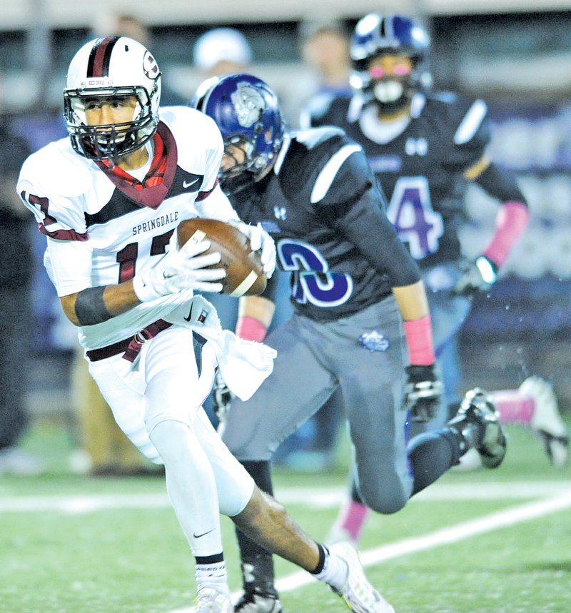  STAFF PHOTO ANDY SHUPE Salvador Sandoval of Springdale heads to the end zone after making a catch against Fayetteville on Oct. 10 at Harmon Stadium in Fayetteville.