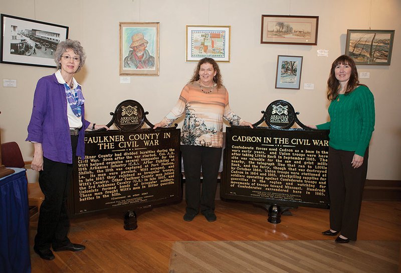 Two Civil War markers will be dedicated during Saturday’s Holiday Open House at the Faulkner County Museum in Conway. One marker will be placed at the Cadron Settlement Park, and the other at the Oak Grove Cemetery. Showing the markers are, from left, Carol Powers, president of the Oak Grove Cemetery Board of Directors; Lynita Langley-Ware, director of the Faulkner County Museum; and Rebekah Bilderback, president of the Faulkner County Historical Society.