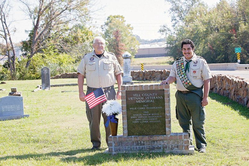 Aaron Hetland, 16, right, and Lyle Hawkins, his grandfather and scoutmaster of Troop 221, stand by the Yell County Vietnam Veterans Memorial. The memorial was Hetland’s idea for his Eagle Scout project. His work was approved at his board review this month, and he will be presented his Eagle Scout badge at an upcoming Court of Honor.