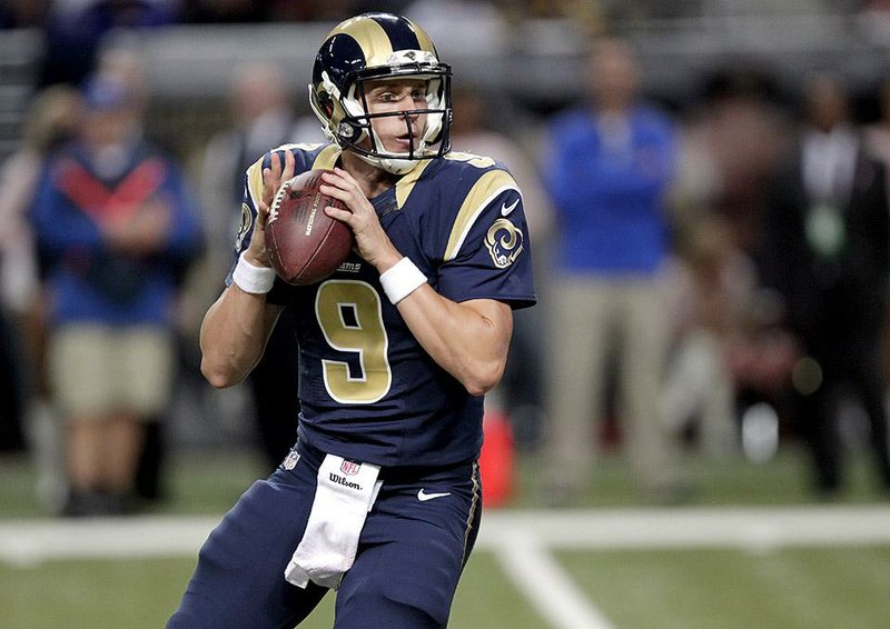 St. Louis Rams quarterback Austin Davis drops back to pass during the fourth quarter of an NFL football game against the Seattle Seahawks Sunday, Oct. 19, 2014, in St. Louis. (AP Photo/Tom Gannam)
