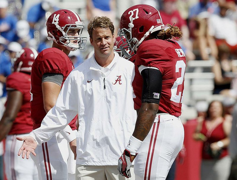 Alabama offensive coordinator Lane Kiffin (center) went 7-6 during his only season as head coach at Tennessee in 2009, but a warm reception from the fans isn’t expected when the Crimson Tide visit Neyland Stadium today.