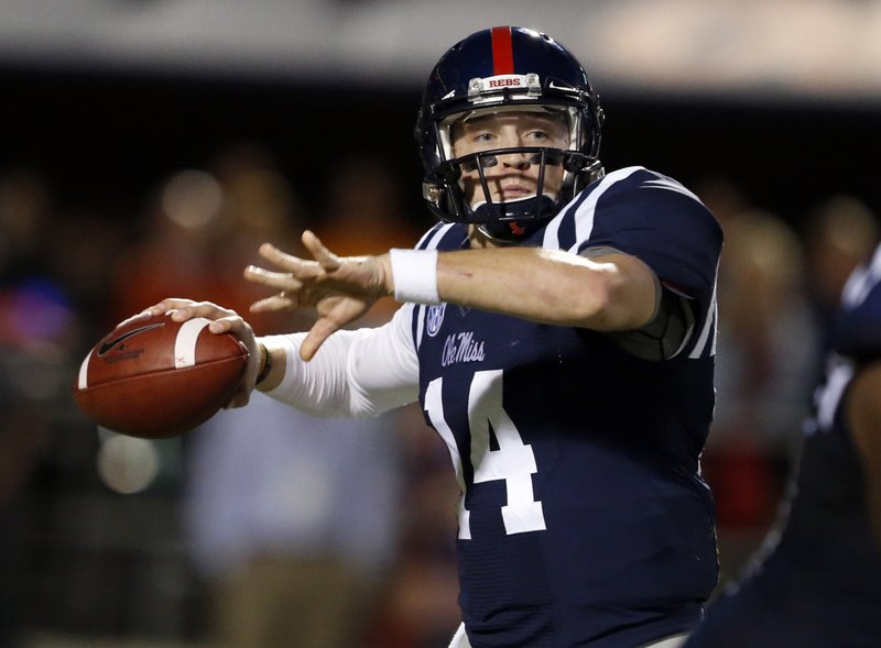 Mississippi quarterback Bo Wallace readies to pass against Tennessee in the second half of an NCAA college football game in Oxford, Miss., Saturday, Oct. 18, 2014. No. 3 Mississippi won 34-3.