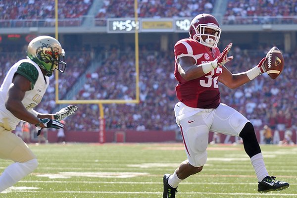 Arkansas running back Jonathan Williams scores on a 17-yard touchdown pass from Brandon Allen during a game against UAB on Saturday, Oct. 25, 2014 at Razorback Stadium in Fayetteville. 