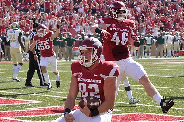 Arkansas long snapper Alan D'Appollonio (82) celebrates after catching a touchdown pass during the second quarter of a game against UAB on Saturday, Oct. 25, 2014 at Razorback Stadium in Fayetteville. 