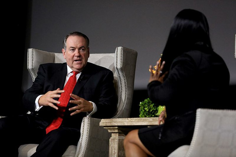 Arkansas Democrat-Gazette/RICK MCFARLAND  --10/26/14--  Former Arkansas Governor Mike Huckabee speaks with Deborah Robinson during a taping of "Conversations with Arkansas Governors" in the Ron Robinson Theater in the Little Rock River Market Sunday. The series includes past Arkansas governors sharing stories of their experience in the position.