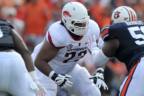 Arkansas offensive lineman Sebastian Tretola lines up against Auburn defenders during a game Saturday, Aug. 30, 2014 at Jordan-Hare Stadium in Auburn, Alabama. 