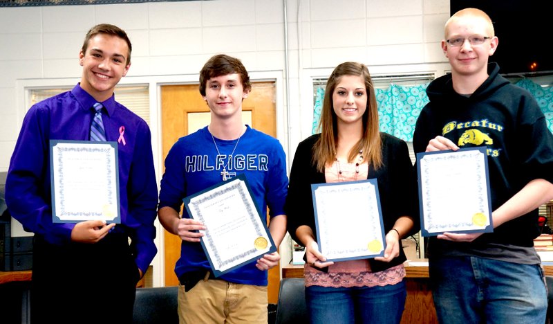 Submitted Photo Left: Four Decatur High School juniors were inducted into the National Honor Society Oct. 6: Tylor Riddle (left), Troy Flood, Haley Burdon and Theodore Clements.