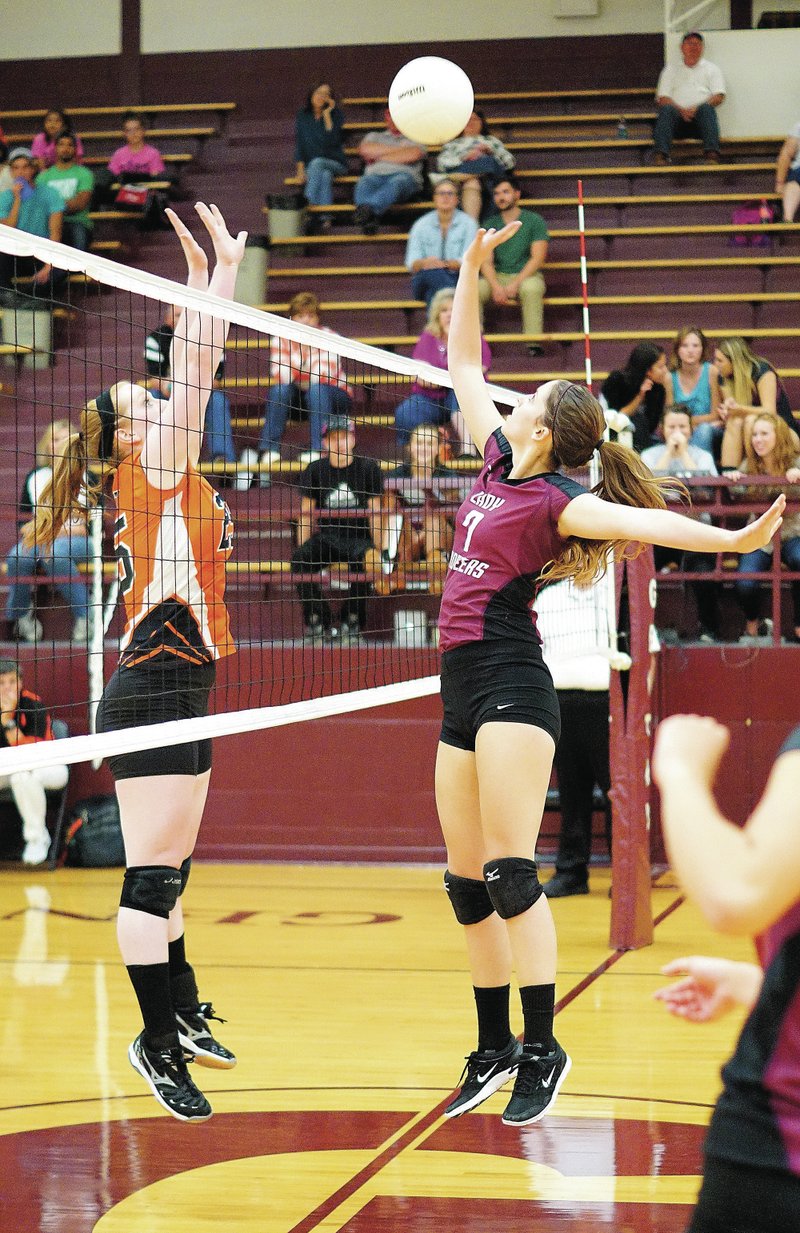 Photo by Randy Moll Gentry and Gravette faced off at the net, both last week and again in district play on Oct. 20. Though Gravette beat Gentry in the district tournament, the Lady Lions fell in the next game of the evening, ending the volleyball seasons for both Gentry and Gravette. Above: Gentry senior Samantha Bailey hits one over Gravette&#8217;s DaMayla Cowan on Oct. 16.