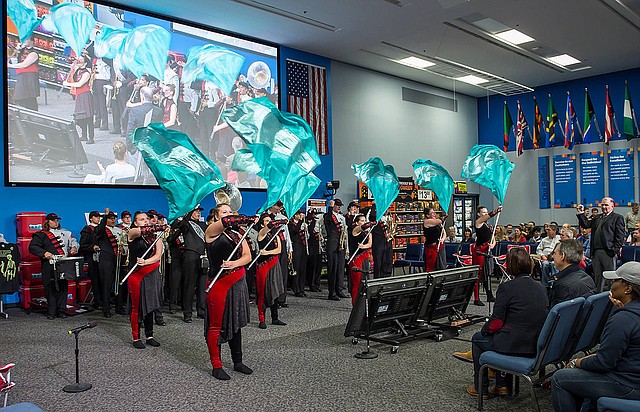Photograph submitted The Pea Ridge Blackhawk Band performed at a Saturday morning meeting recently for Walmart associates. The band received a monetary gift from Walmart for performing a pep rally to start the meeting with guest host Quinn Grovey.