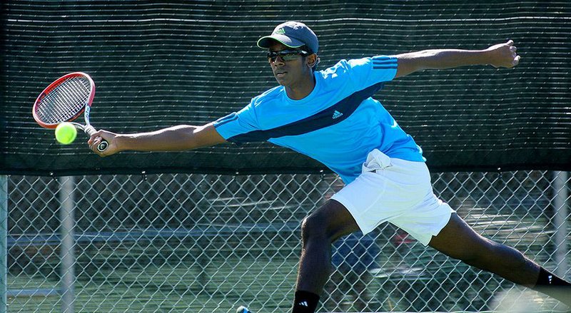 Anil Chakka of Little Rock Central returns a shot during the final of the high school Overall tennis tournament Thursday at Burns Park in North Little Rock. Chakka, who captured the Class 7A title last week, came back to beat Matt Talbert of Hot Springs Lakeside in the final. 