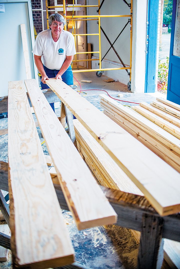Ross White, a carpenter with Top-Notch Construction, lines up some boards as he works on the refurbishment of the former Dryden Pottery building in Hot Springs. The structure on Whittington Street houses Emergent Arts, formerly known as Artchurch Studio.