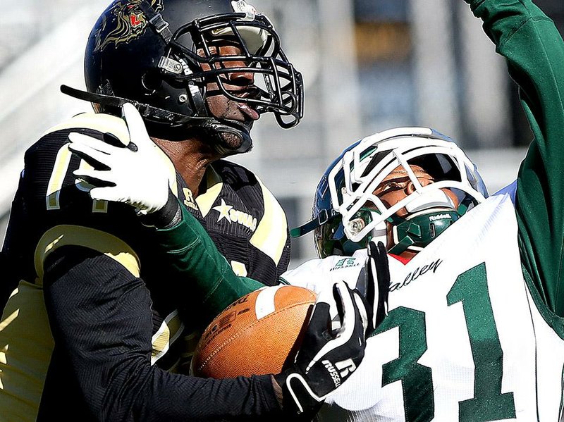 UAPB wide receiver Isiah Ferguson (left) has a pass slip through his hands while Mississippi Valley State’s Le’Trey Jones defends during Saturday’s game. UAPB held on for a 24-14 victory to win its second consecutive game.