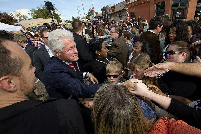 Former President Bill Clinton meets supporters Sunday afternoon Nov. 2, 2014 in Texarkana, Ark., while stumping for Arkansas Democratic hopefuls. Clinton's visit is the third to Arkansas to help his home state's party. (AP Photo/The Texarkana Gazette, Evan Lewis)