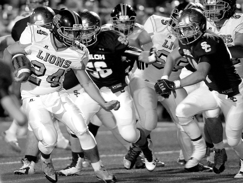 Photo by J.T. Wampler Gravette&#8217;s Jordan Burnett looks for running room against Shiloh Christian on Friday in Springdale.