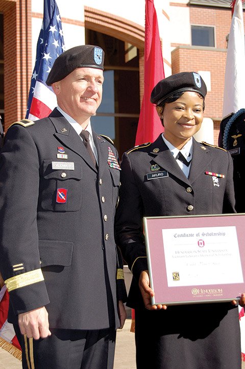 Brig. Gen. Keith Klemmer, the deputy adjutant general of the Arkansas Army National Guard, stands with Henderson State University Cadet Vera Akuro, the winner of the first HSU Vietnam Memorial Scholarship honoring nine graduates of the ROTC program at Henderson who were killed while serving in the military in Vietnam. Akuro, a native of Cameroon, is a junior and a student in the university’s nursing program. The scholarship was awarded in a ceremony on the university Quad the morning of HSU Family Day.