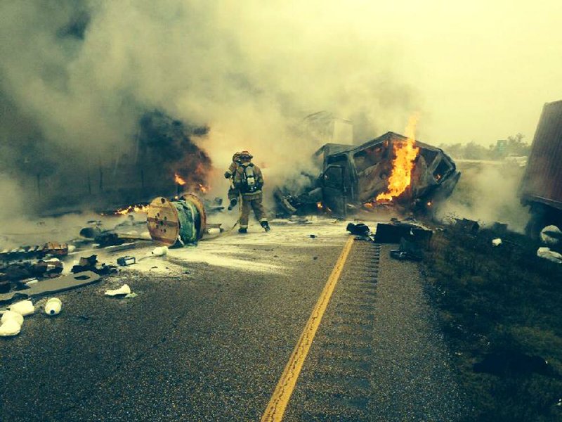 The West Memphis Fire Department, assisted by the Marion and Edmondson departments, responds to a multivehicle crash on Interstate 40 that shut traffic down for several hours. Seven vehicles, including four tractor-trailer rigs, were involved in the crash, and two people were pronounced dead at the scene.