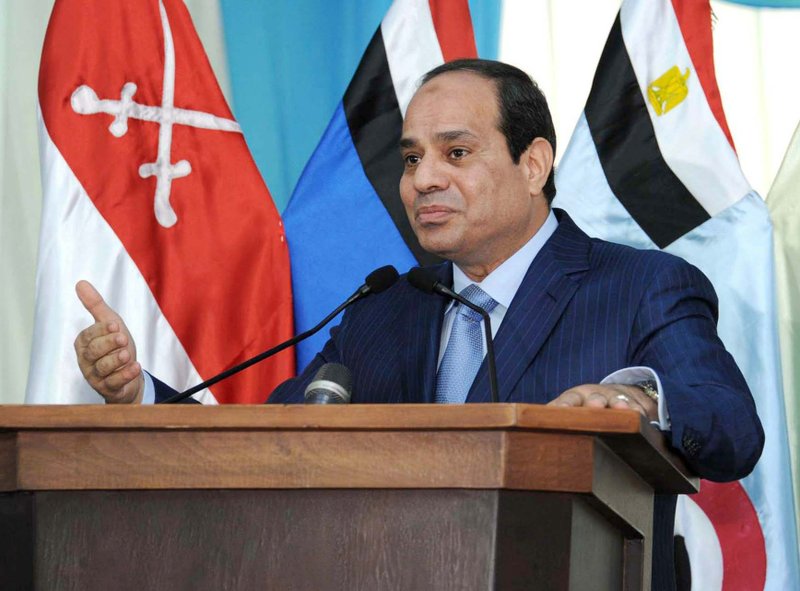 In this Monday, Nov. 3, 2014 image released by the Egyptian Presidency, Egyptian President Abdel-Fattah el-Sissi, left, delivers a speech during an Air Force exercise as part of Badr 2014 Strategic Maneuver, in the Nile Delta province of al-Sharqia, Egypt. President Sissi attended the Air Force exercises Monday, which the government said involved more than 250 combat fighters and helicopters. The Badr 2014 Strategic Maneuver is a 17-day-long military exercise conducted by the Egyptian army and air force. The government says the maneuvers are designed to repel "hostile forces."