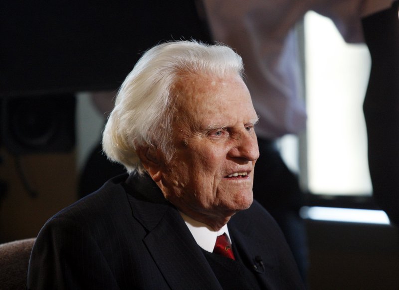 In this Dec. 20, 2010, file photo, Rev. Billy Graham is interviewed at the Billy Graham Evangelistic Association headquarters in Charlotte, N.C.