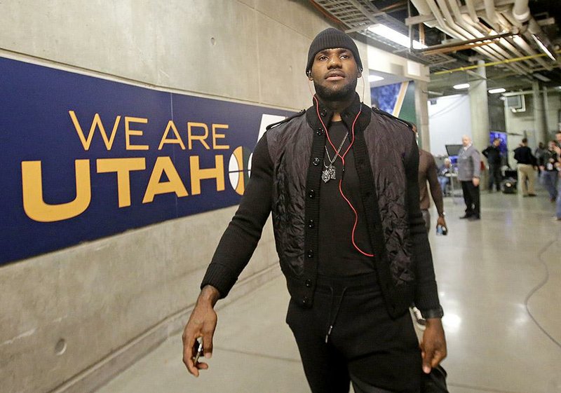 Cleveland Cavaliers' LeBron James (23) arrives at EnergySolutions Arena before the start of their NBA basketball game against the Utah Jazz, Wednesday, Nov. 5, 2014, in Salt Lake City. (AP Photo/Rick Bowmer)