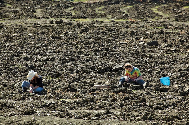 The Sentinel-Record/Corbet Deary VISITORS FROM AFAR: People travel from abroad to try their hand at digging for precious stones at Crater of Diamonds State Park.