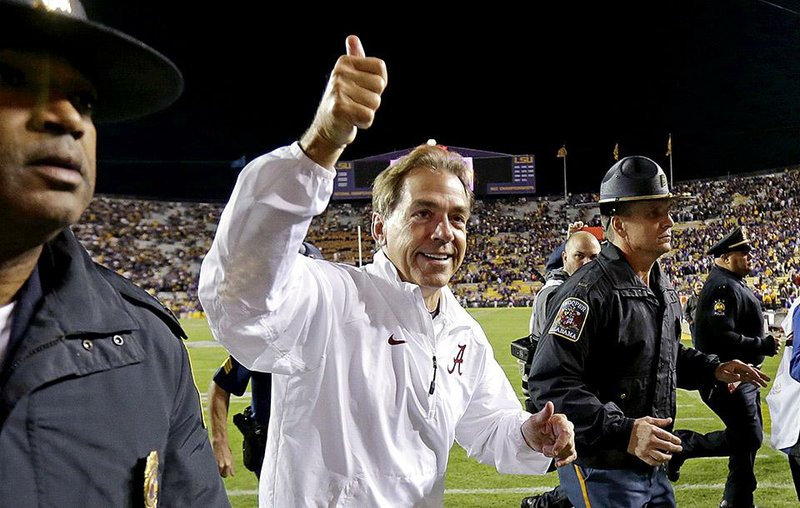 Alabama Coach Nick Saban was all smiles after the fi fth-ranked Crimson Tide edged LSU 20-13 in overtime Saturday in Baton Rouge.