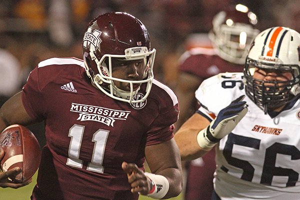 Mississippi State quarterback Damian Williams (11) sprints past Tennessee-Martin's Jay Murphy (56) during the second half of an NCAA college football game in Starkville, Miss., Saturday, Nov. 8, 2014. Mississippi.State won 45-16. (AP Photo/Jim Lytle)