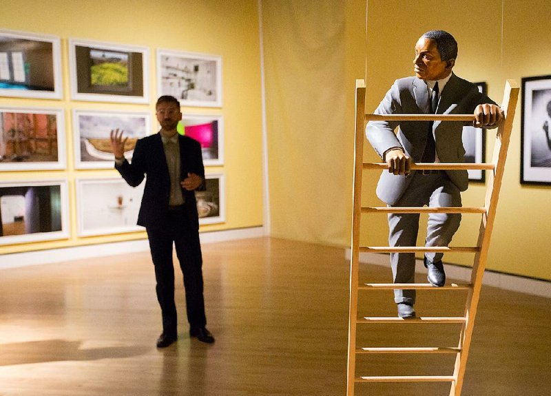 NWA Media/JASON IVESTER --09/11/2014--
Assistant curator Chad Alligood (left) describes art pieces to members of the media during a tour of the State of the Art exhibit on Thursday, Sept. 11, 2014, at Crystal Bridges Museum of American Art in Bentonville.