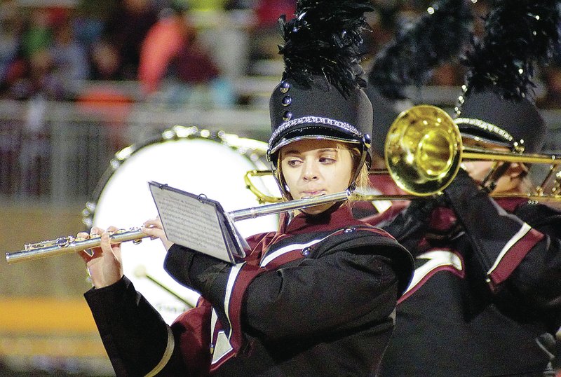 Photo by Randy Moll Katelyn Brinkley plays the flute during a performance of the Gentry Marching Band in Gravette on Friday night.