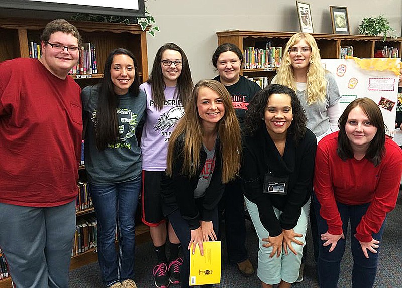 Photographs submitted Students from the Pea Ridge High School Spanish Club with Mrs. Crystal Marquez read books to Intermediate School students for Family Reading Night recently.