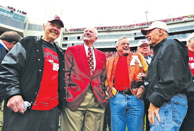  File Photo Wayne Harris, left, Frank Broyles, Lance Alworth and Jim Mooty share a laugh while waiting for a ceremony to honor the 1959 football team during the Razorbacks&#8217; game Oct. 10, 2009 at Reynolds Razorbacks Stadium in Fayetteville.