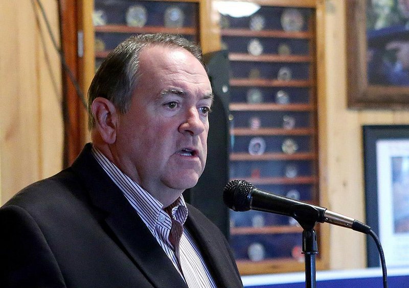 Gov. Mike Huckabee speaks to an early morning crowd at the Smok'n Pig restaurant in support of David Purdue's senate campaign on Friday, Oct. 31, 2014, in Valdosta, Ga. Huckabee says he is ending his six-year run as a TV host on Fox News, a decision that will fuel speculation about the Republican’s plans for another White House bid. Fox News reports that Huckabee says he will decide in this spring whether to campaign for president in 2016. 