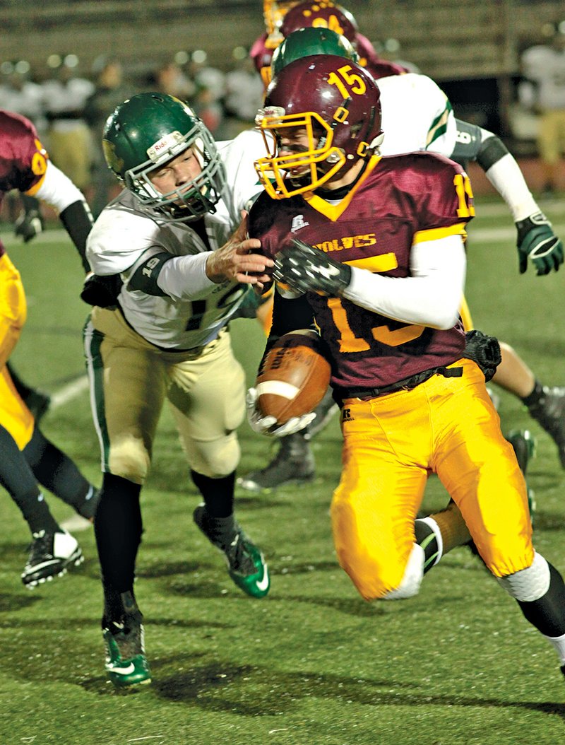 The Sentinel-Record/Corbet Deary HAPPY RETURN: Lake Hamilton’s Dallas Baldwin (15) returns an Alma kickoff 49 yards in the first half of a Class 6A first-round playoff game Friday night at Bank of the Ozarks Field. Alex Beneux, here pursuing Baldwin, alternated at quarterback on the Airedales’ first scoring drive. The Crawford County visitors advanced to the quarterfinals against Jonesboro with a 14-7 victory over the Wolves.