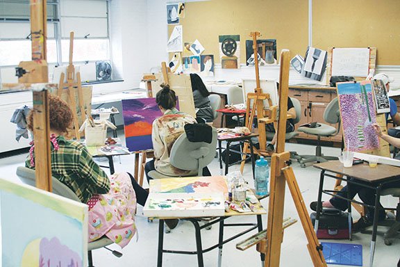 From left, Ashley Randels of Rogers, Perni Adcock of Prospect, Texas, and Katherine Love of Covington, La., work on their assignments during their painting class in the Rosemary Adams Department of Visual Arts at Ouachita Baptist University in Arkadelphia. The department is adding a new gallery for exhibitions as part of renovations throughout the department following a donation from Adams, for whom the department and gallery are now named.
