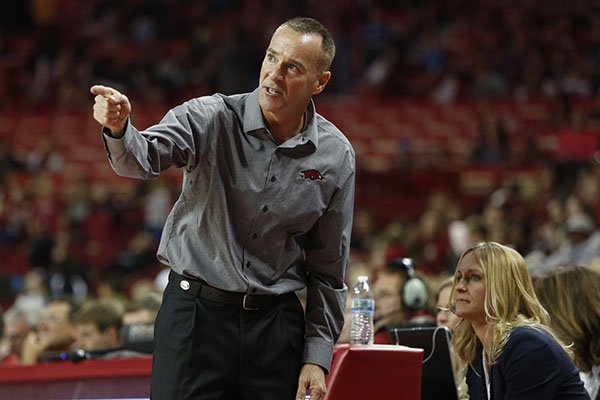 Arkansas coach Jimmy Dykes motions while assistant coach Christy Smith watches from the sideline during a game against Nicholls on Friday, Nov. 14, 2014 at Bud Walton Arena in Fayetteville. 
